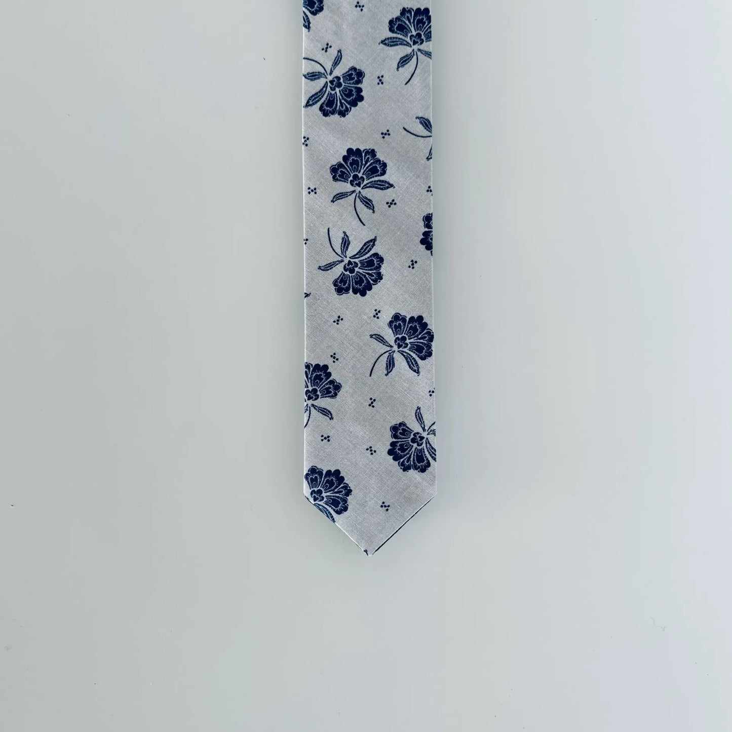 Classic blue tie with floral vintage print