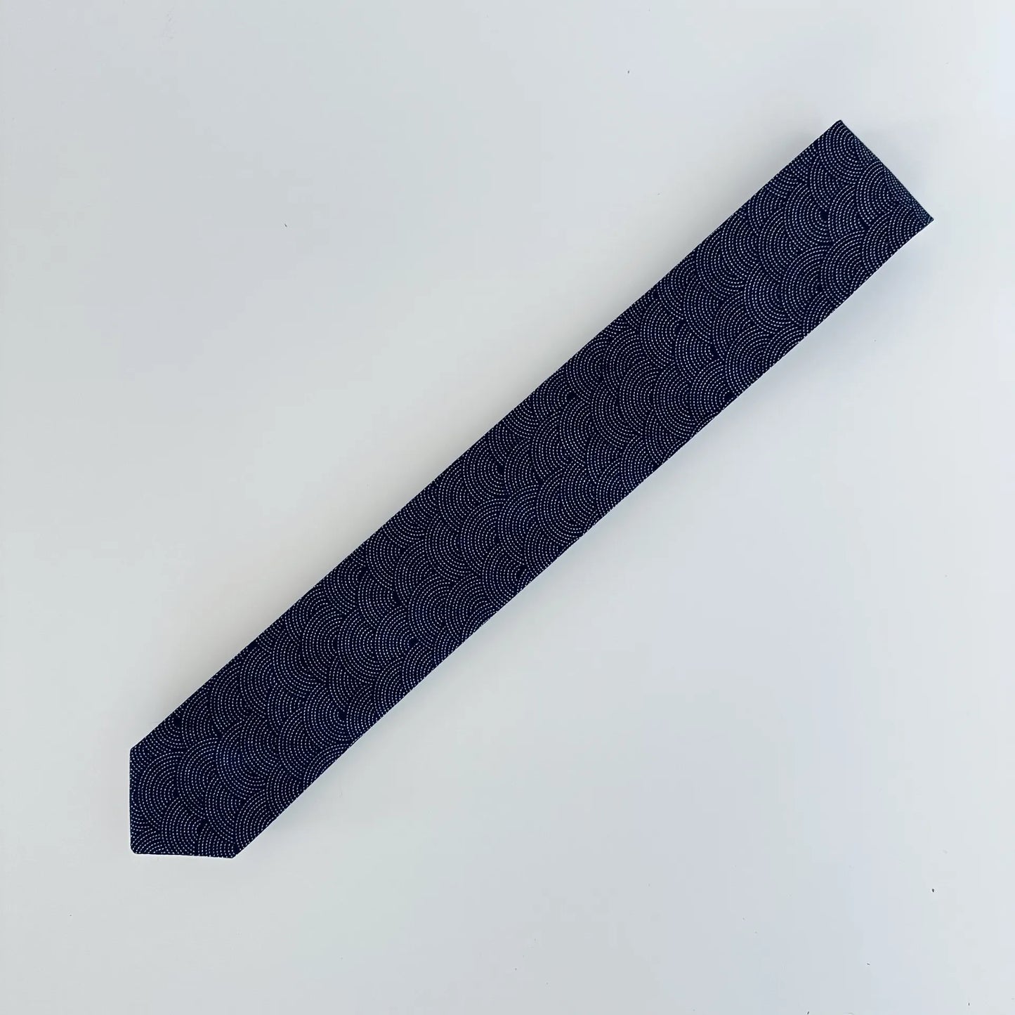 Elegant dark navy tie with scallop pattern