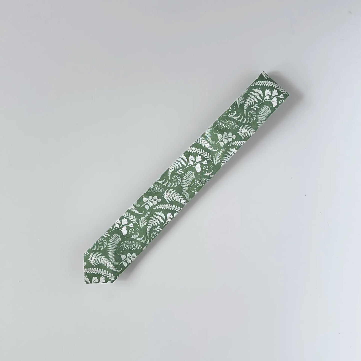 Handcrafted sage green floral tie, made with locally sourced materials in Canada for a sustainable, stylish look