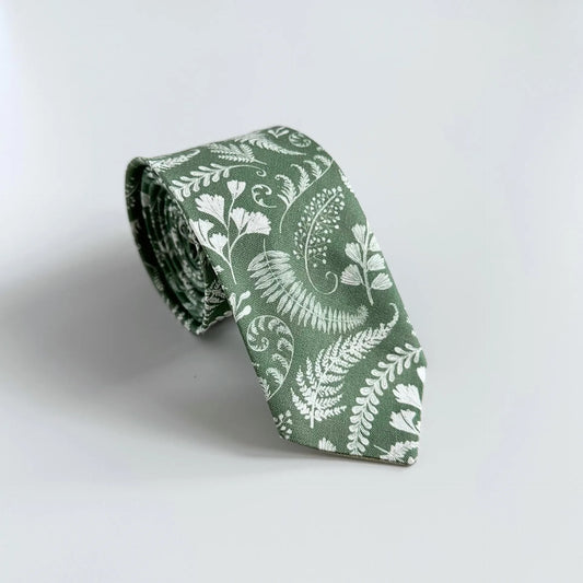 Sage green floral tie with white botanical flowers, handmade in Canada using premium cotton and satin